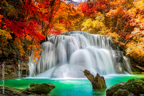 Amazing in nature, beautiful waterfall at colorful autumn forest in fall season
