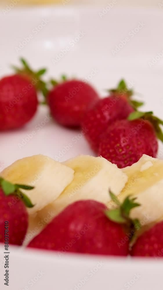 put strawberries and bananas with a heart Cooking strawberry and banana milkshake or smoothie in blender. Pouring ripe fruits in blender. Slow motion. Healthy drink concept put strawberries and bananas with a heart Cooking strawberry and banana milkshake or smoothie in blender. Pouring ripe fruits in blender. Slow motion. Healthy drink concept