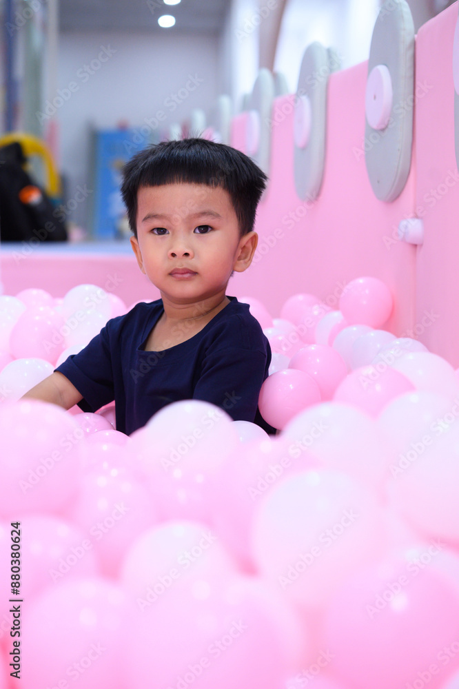 Photo of Asian kid in the playground indoor Photo of Asian kid in the playground indoor
