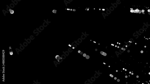 Abstract composition of grayscale light streaks and circular patterns on black background, creating dynamic visual effect. Varying sizes and shades of the circles add depth and motion to the scene.