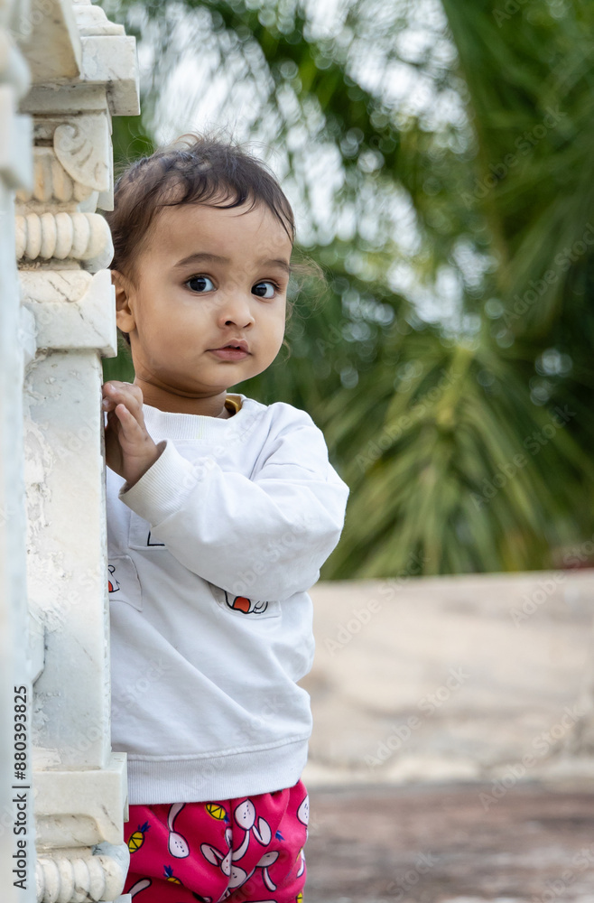 cute toddler innocent portraits at temple courtyard at day from unique perspective cute toddler innocent portraits at temple courtyard at day from unique perspective