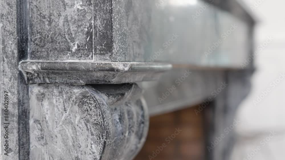 Slow descending bokeh shot of an antique stone fireplace facade within a villa Slow descending bokeh shot of an antique stone fireplace facade within a villa