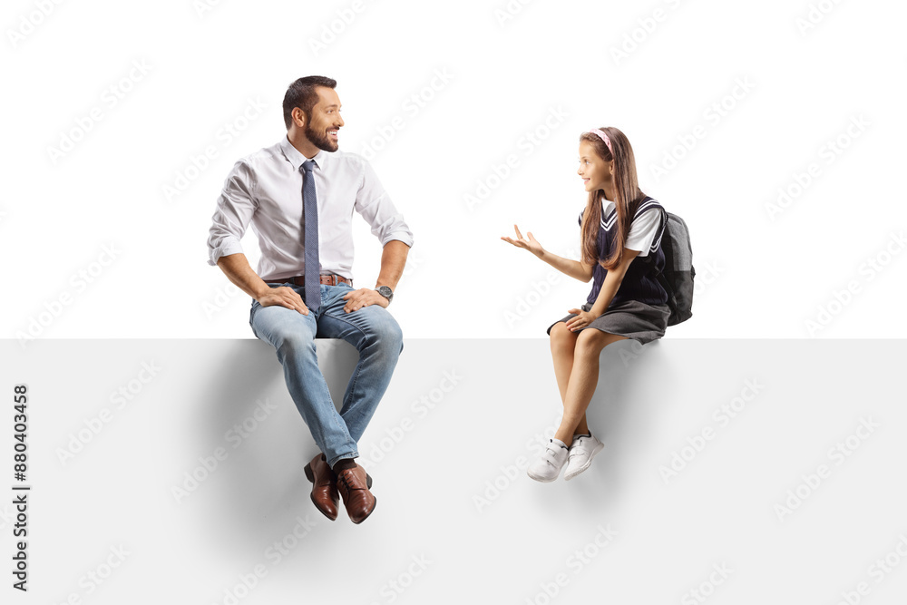 Schoolgirl sitting on a panel and talking to a man