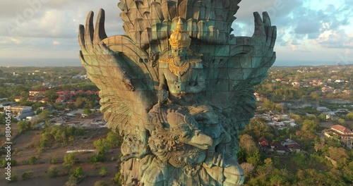 Drone Aerial view 4k Statue of Vishnu in Garuda Wisnu Kencana Cultural Park at sunrise. Bali's Most Iconic Landmark Hindu God Garuda Wisnu Kencana, Bali, indonesia.