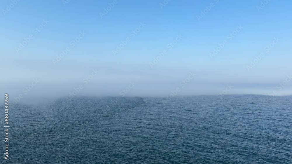 Natural phenomenon of steam fog over calm sea water. Natural phenomenon of steam fog over calm sea water.