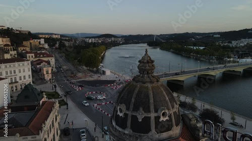 Aerial video of the Mondego River in front of downtown Coimbra, Europe, Portugal
