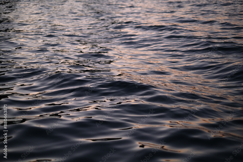 small waves on the sea during sunset close-up small waves on the sea during sunset close-up