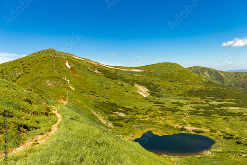 A beautiful landscape in the mountains, the sky with clouds on a summer day. photo