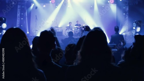 Wallpaper Mural Crowd by music concert back view. Crowd, concert and music festival, party and dance, jumping and social nightclub, edm youth culture and rave show. Top view of happy audience, fans and disco 4k Torontodigital.ca