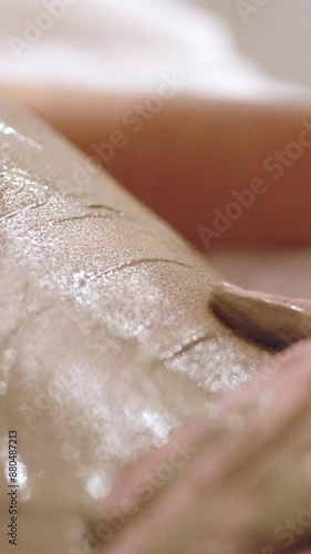 Wallpaper Mural Close-up of a person's skin with a layer of mud applied during a spa treatment. The texture of the skin and the mud is clearly visible, highlighting the smooth and therapeutic nature of the treatment Torontodigital.ca