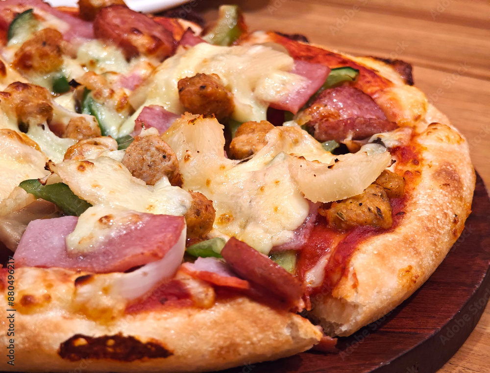 italian super deluxe pizza on wooden plate italian super deluxe pizza on wooden plate