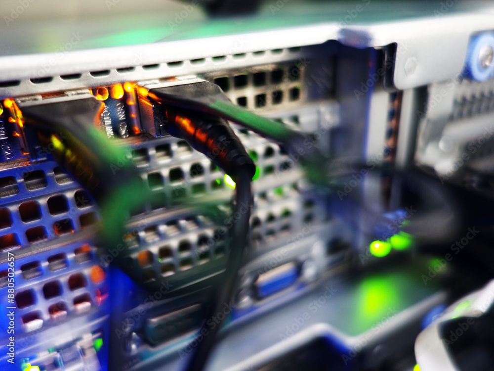 Naklejka premium network cables connected to switch - closeup of data center hardware technology