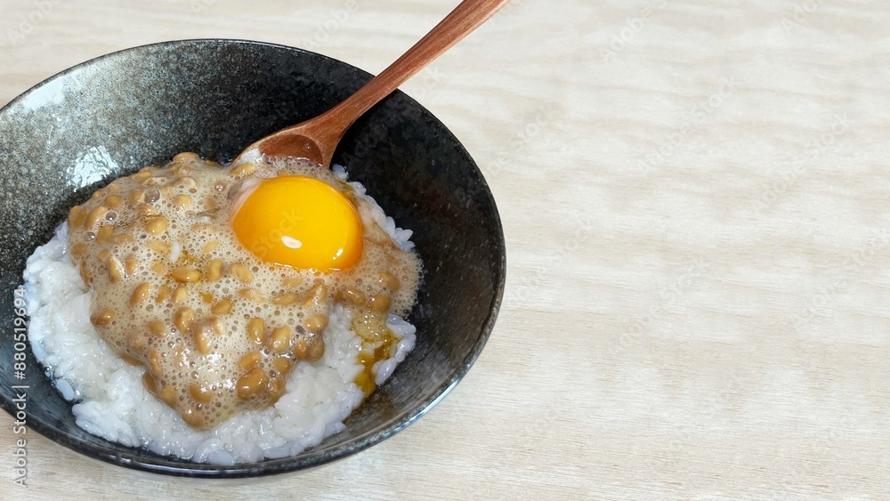 Rice topped with natto (Japanese fermented beans) and eggs Rice topped with natto (Japanese fermented beans) and eggs