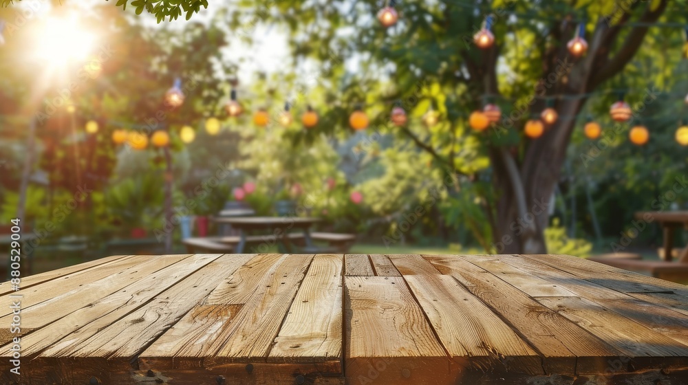 A blurry wooden table is surrounded by a party in a garden and overlooks a beautiful natural scene A blurry wooden table is surrounded by a party in a garden and overlooks a beautiful natural scene