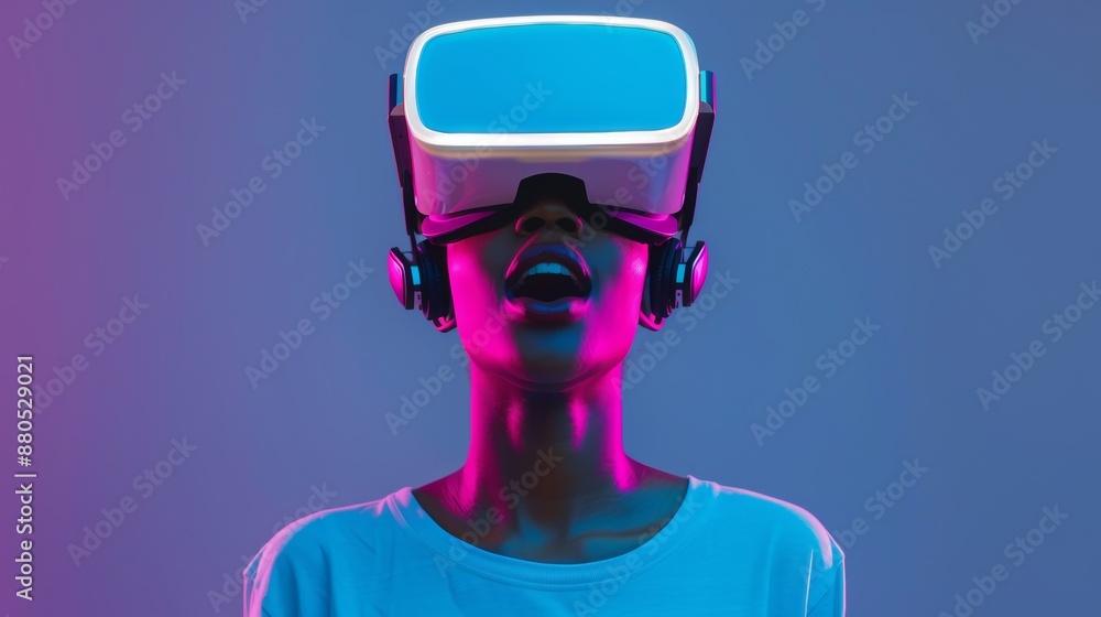 A young African-American woman using VR-glasses on a blue background with neon lights. Concept of human emotions, facial expressions, modern gadgets and technologies. Gladness and amazement are A young African-American woman using VR-glasses on a blue background with neon lights. Concept of human emotions, facial expressions, modern gadgets and technologies. Gladness and amazement are
