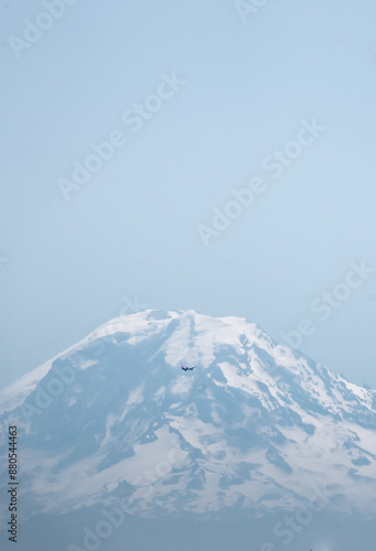 Airplane in front of mt ranier in seattle