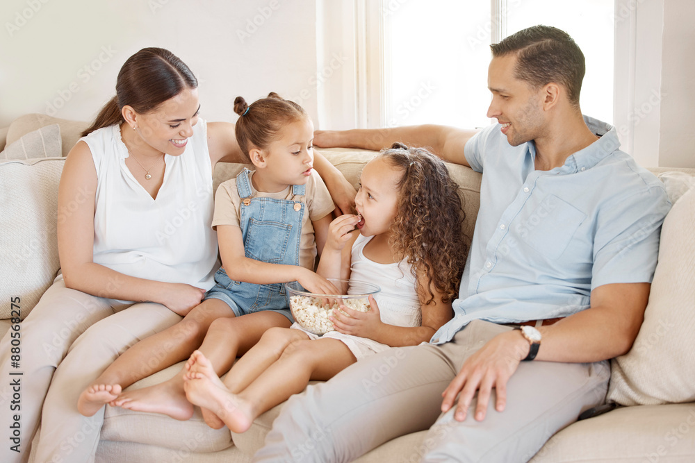 People, family and happy with popcorn in sofa at home for fun, bonding and support for memories. People, mom and dad with kids on couch at living room with smile or relax for snack, love and trust People, family and happy with popcorn in sofa at home for fun, bonding and support for memories. People, mom and dad with kids on couch at living room with smile or relax for snack, love and trust