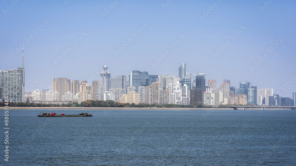 Modern City Skyline with River View and Clear Sky Modern City Skyline with River View and Clear Sky