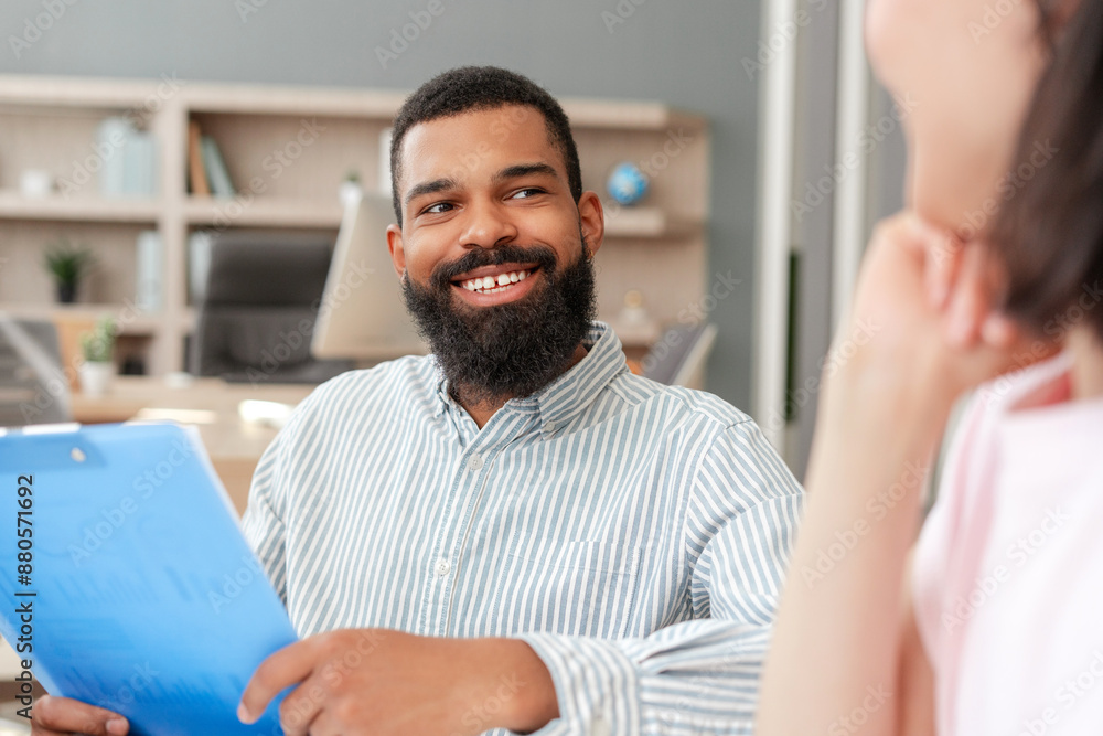 Fototapeta premium African American professional smiling during job interview with recruiter