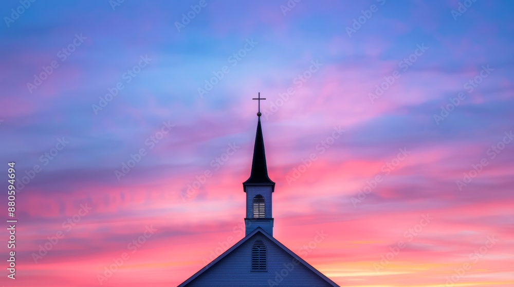 Fototapeta premium '' silhouette of a Protestant church steeple against a dramatic sunrise with vibrant colors 