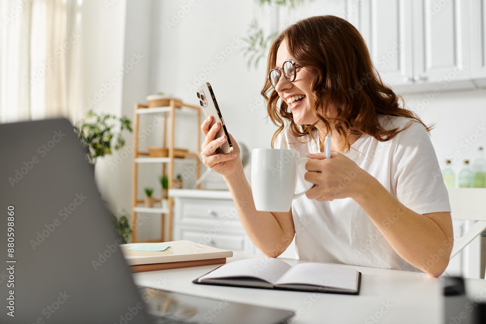 Middle-aged woman typing on a laptop, sipping from a mug at a cozy table. Middle-aged woman typing on a laptop, sipping from a mug at a cozy table.