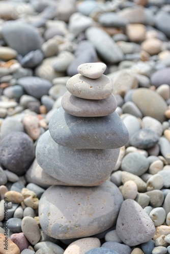 Stone pebble tower. beach background. Balanced stones on a pebble beach. Pyramid, Pile Of Stones