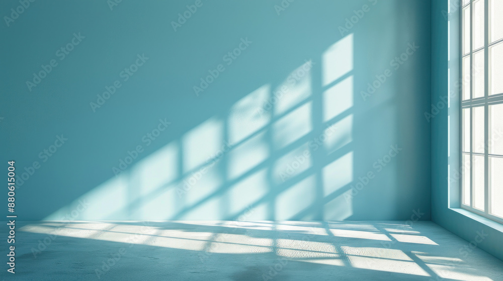 Clean, simple background in light blue for presenting products. Shadows and light from windows on the wall. Clean, simple background in light blue for presenting products. Shadows and light from windows on the wall.
