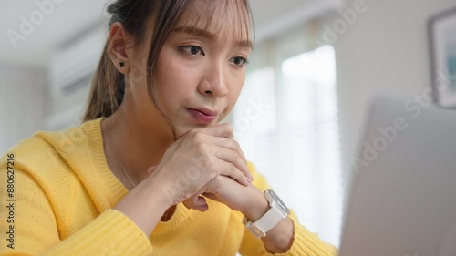 Asia people young woman study hard brownout bored remote work fix coding bug online read data tired sitting at home desk think worry in career job tough stress workforce mental health issue illness. photo