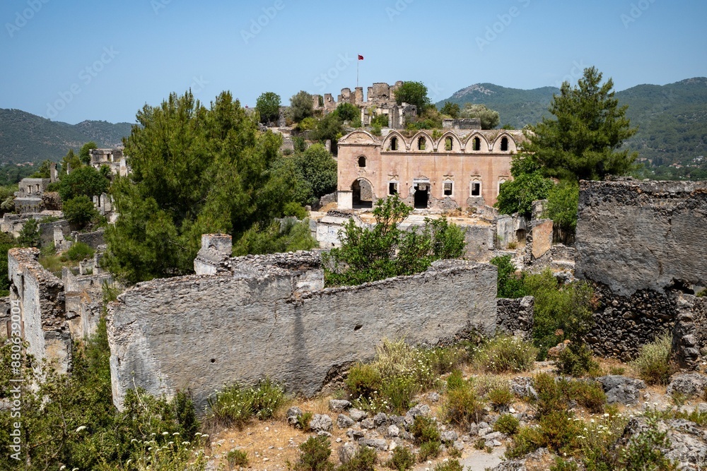 Ruins of the ghost town of Kayakoy on a sunny day in Kayakoy neighborhood, Fethiye, Mugla, Turkey Ruins of the ghost town of Kayakoy on a sunny day in Kayakoy neighborhood, Fethiye, Mugla, Turkey