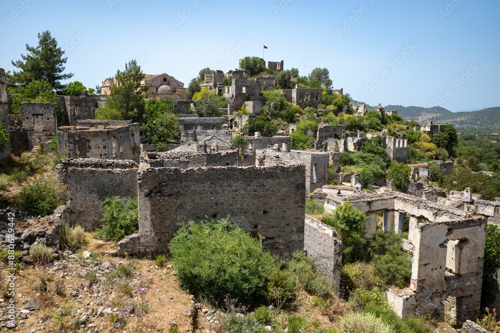Fototapeta premium Ruins of the Abandoned Village of Kayakoy on a sunny day in Fethiye, Mugla Province, Turkey