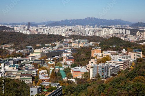 Sillim-dong, Gwanak-gu, Seoul, South Korea - November 10, 2023: High angle and autumnal view of buildings of Seoul National University amid Gwanaksan Mountain
 photo