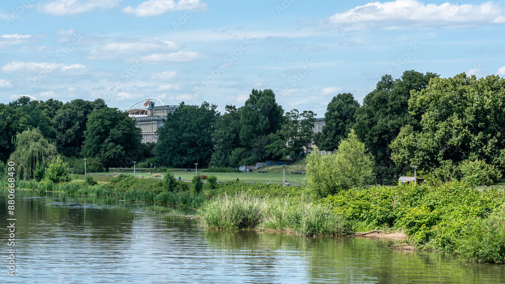 View from the Palmengarten Wehr at the Elster river in Leipzig View from the Palmengarten Wehr at the Elster river in Leipzig