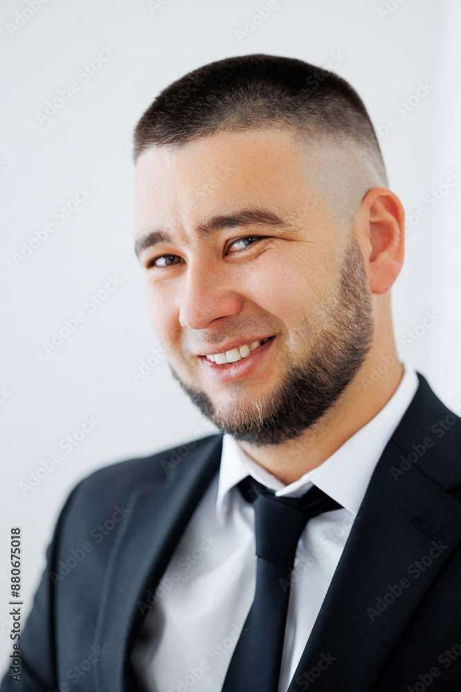 A man with a shaved head and a beard is smiling and wearing a suit and tie. He looks confident and professional A man with a shaved head and a beard is smiling and wearing a suit and tie. He looks confident and professional