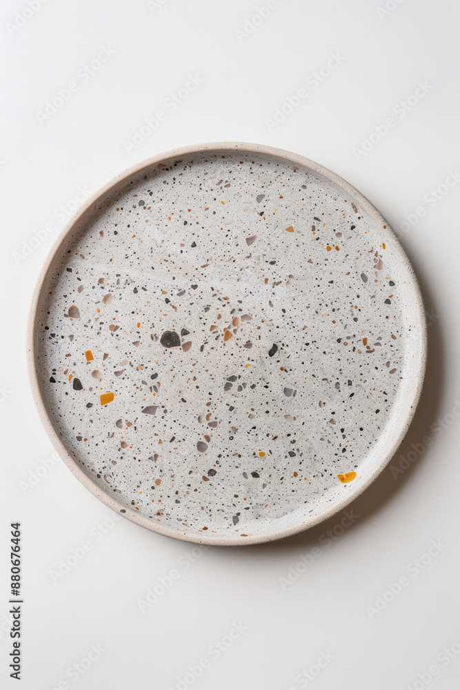 Empty terrazzo plate on white background, showcasing speckled design and modern aesthetic for kitchenware, decor, or food graphy. Empty terrazzo plate on white background, showcasing speckled design and modern aesthetic for kitchenware, decor, or food graphy.