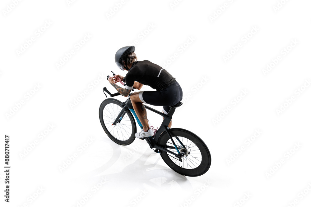 Obraz premium Aerial view of cyclist, determined athlete in professional attire and helmet, riding bike isolated on white background. Concept of sport, competition, tournament, speed, endurance. Isometric view