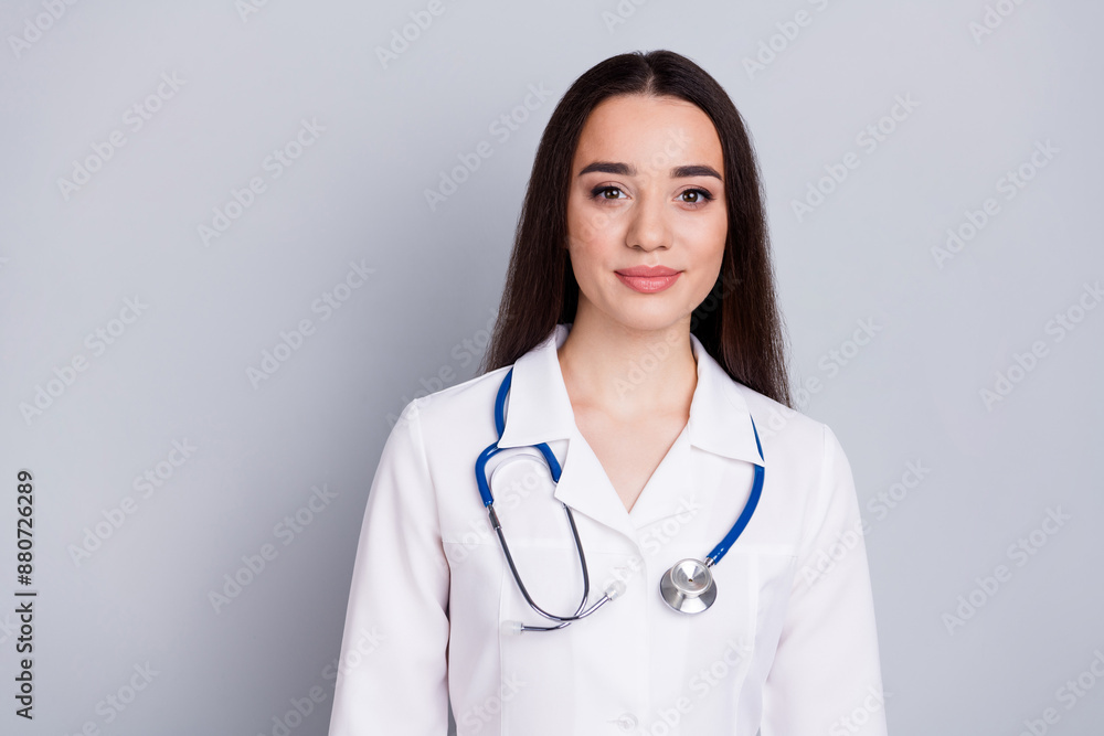 Portrait of qualified doctor woman empty space white coat isolated on grey color background Portrait of qualified doctor woman empty space white coat isolated on grey color background