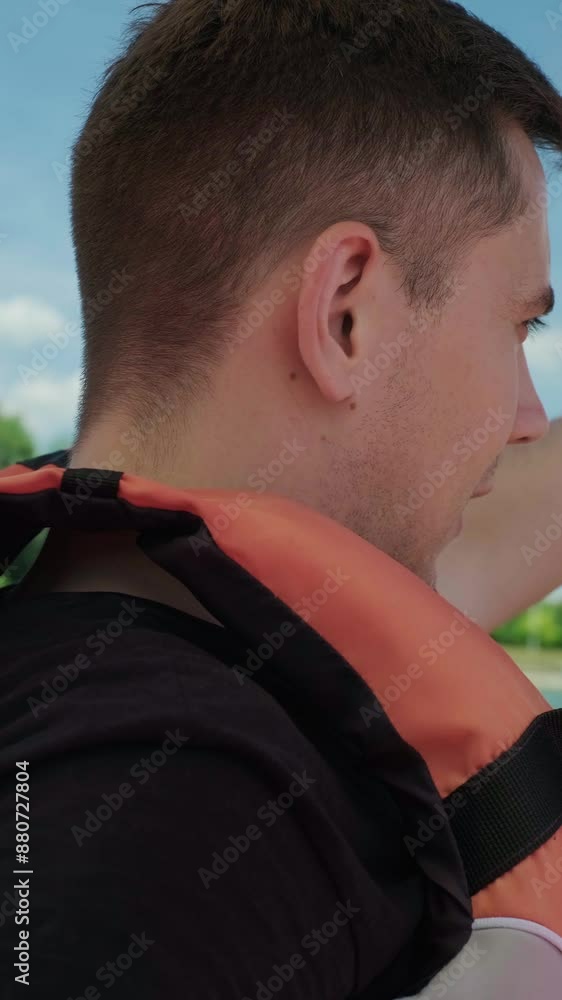 Man enjoying water recreation on a boat, promoting resorts and lodges offering peaceful lakefront relaxation. Man enjoying water recreation on a boat, promoting resorts and lodges offering peaceful lakefront relaxation.