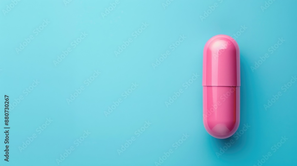 Pink pill on blue background with space for text Medical and healthcare idea Pink pill on blue background with space for text Medical and healthcare idea