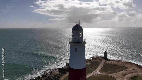 Discover the iconic Portland Bill Lighthouse in Dorset, a breathtaking coastal landmark surrounded by rugged cliffs and stunning seascapes. Perfect for capturing the essence of maritime heritage 
