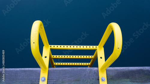 Yellow ladder to get swimmers out of the water in the harbour