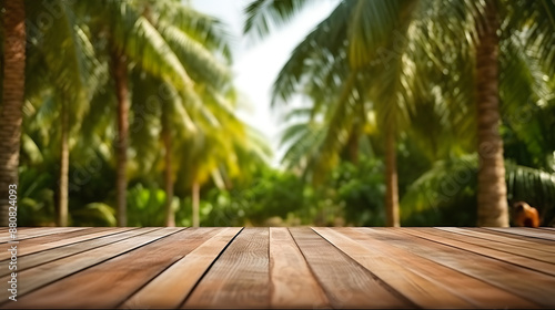 A scenic view of tropical palm trees with a wooden deck in the foreground The lush greenery and clear sky in the background create a peaceful and inviting atmosphere perfect for relaxation and outdoor