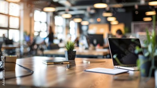 Office Background with Blurry People, Documents, and Laptops