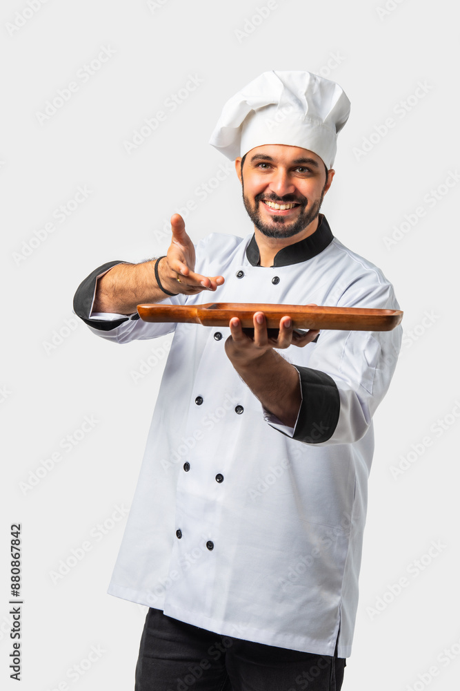 Indian asian young Chef in uniform happily presenting empty white ceramic plate on white background Indian asian young Chef in uniform happily presenting empty white ceramic plate on white background