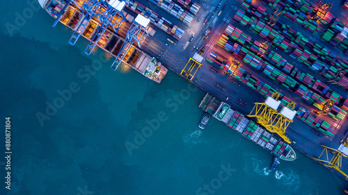 Obraz na płótnie Aerial view container cargo ship at commercial sea port, Global business logistic import export transportation international by container cargo ship, Container cargo ship freight shipping at night. w salonie