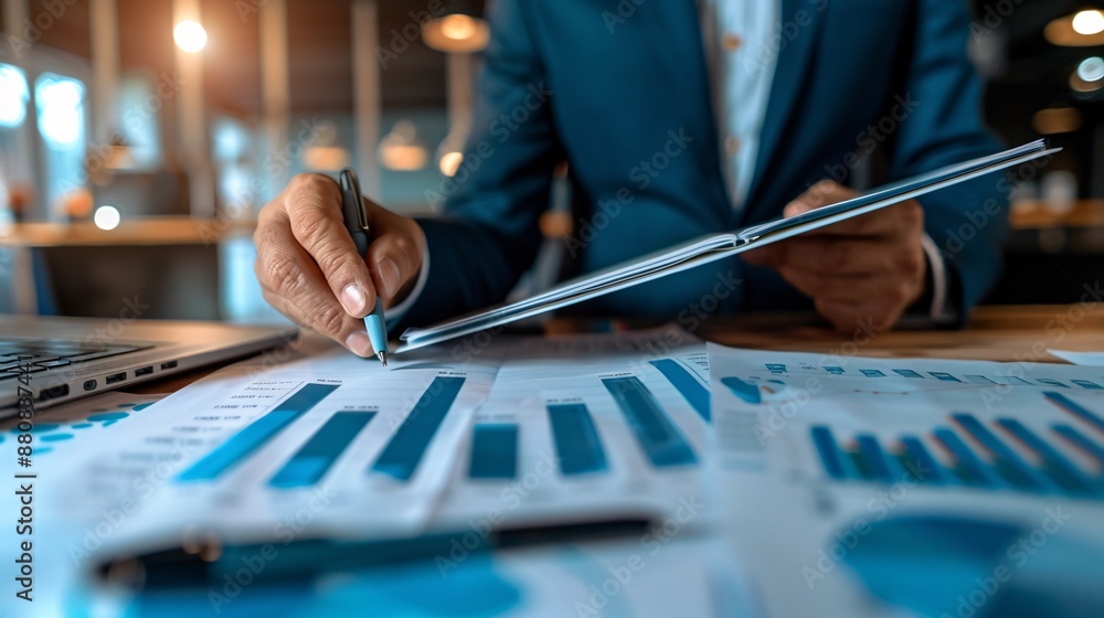 Business Man Analyzing Data. Male Executive Examining Charts and Graphs, Interpreting Data for Strategic Business Decisions, Expert Analysis and Financial Planning for Corporate Growth. Business Man Analyzing Data. Male Executive Examining Charts and Graphs, Interpreting Data for Strategic Business Decisions, Expert Analysis and Financial Planning for Corporate Growth.
