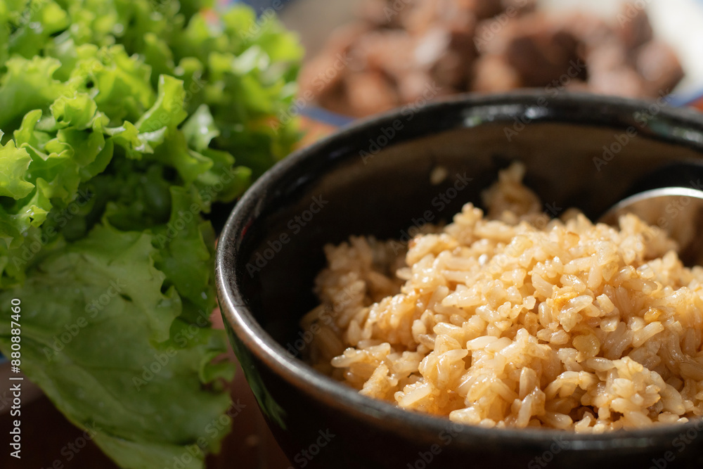 Bowl of rice, Garlic fried rice serve with vegetables. Bowl of rice, Garlic fried rice serve with vegetables.