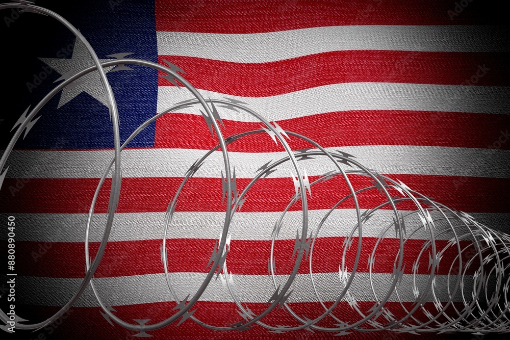 Obraz premium Spiral barbed wire and flag of Liberia - 3d illustration