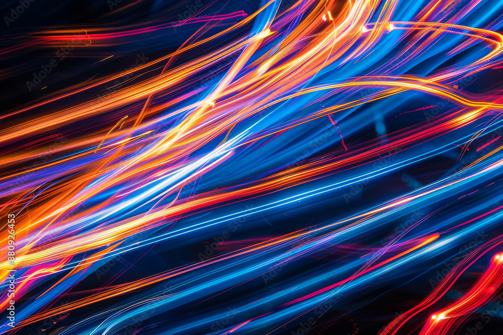 Vivid light trails of blue and orange intertwine in an abstract dance of energy and color, creating a dynamic visual spectacle. Vivid light trails of blue and orange intertwine in an abstract dance of energy and color, creating a dynamic visual spectacle.