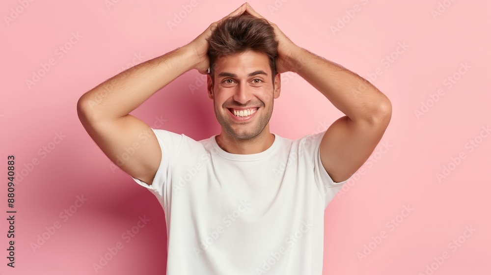A man with a white shirt and short hair is smiling and has his hands on his head. Concept of confidence and self-assurance A man with a white shirt and short hair is smiling and has his hands on his head. Concept of confidence and self-assurance