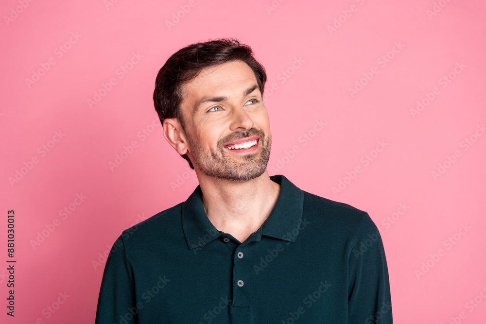 Photo of nice young man look empty space wear pullover isolated on pink color background Photo of nice young man look empty space wear pullover isolated on pink color background